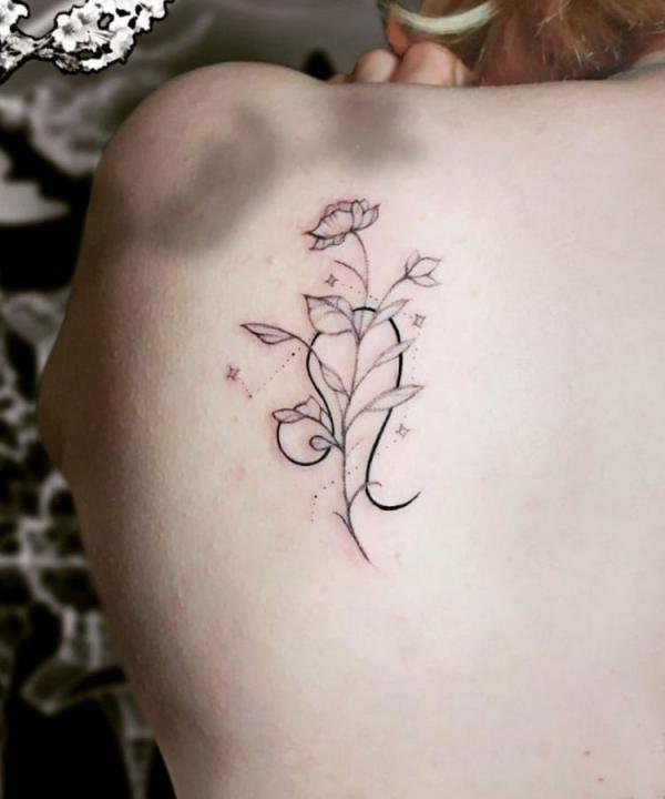 Leo with flowers shoulder blade tattoo