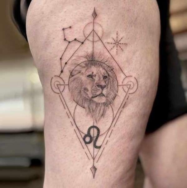 Lion head with Leo constellation and glyph thigh tattoo
