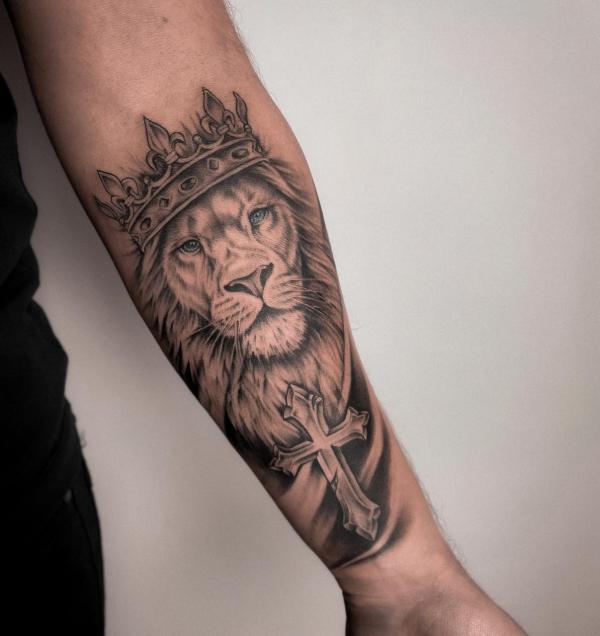 Lion king and cross tattoo forearm