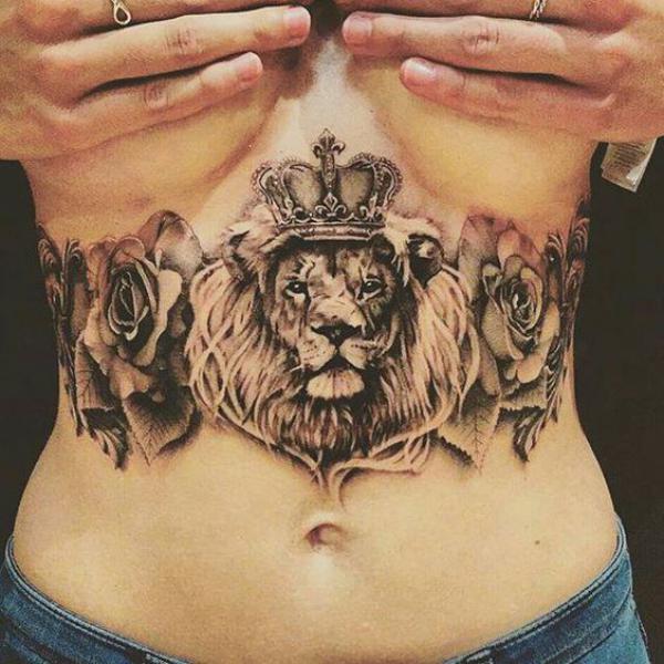 Lion king with roses stomach tattoo