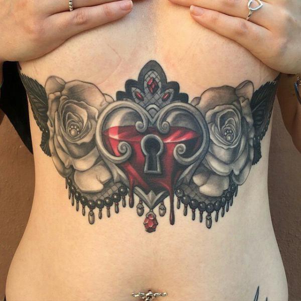 Lock with roses stomach tattoo