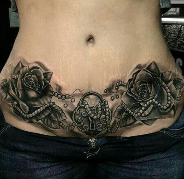 Lock with roses tummy tattoo black and white