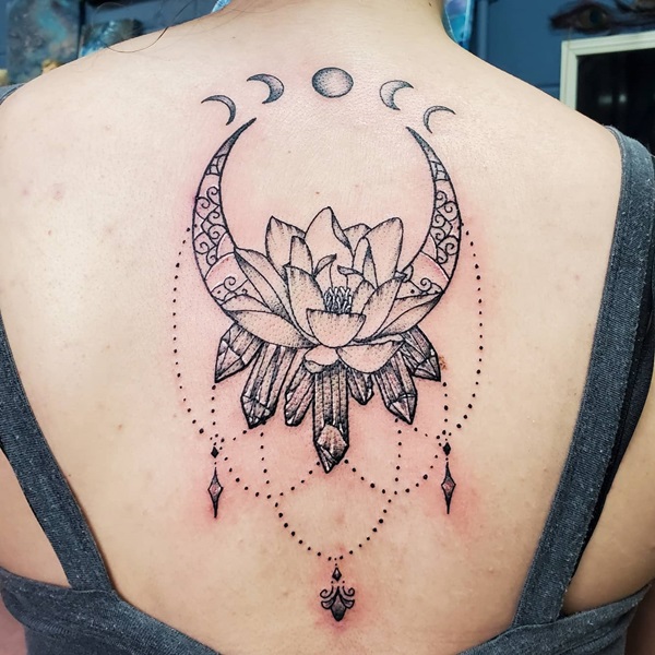 Lotus with moon phases and crystal tattoo