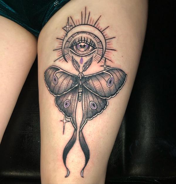 Luna moth and all seeing eye tattoo on thigh