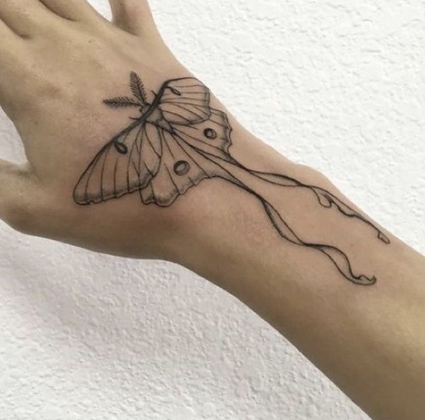 Luna moth hand tattoo black and grey