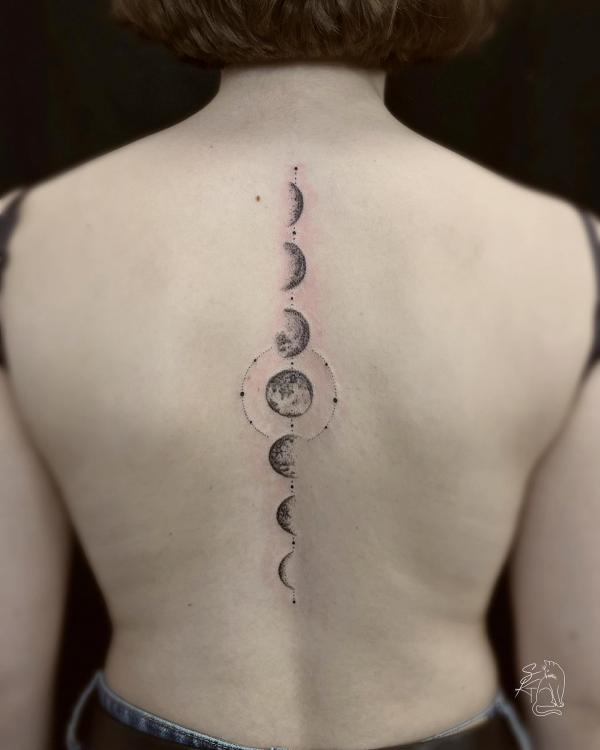 Lunar cycle spine tattoo