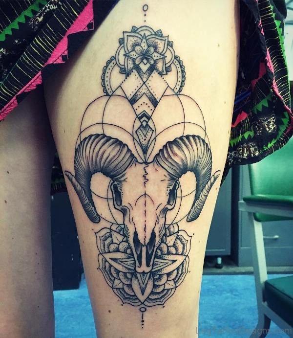 Mandala and ram skull thigh tattoo