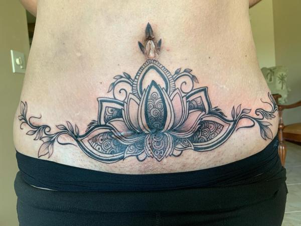 Mandala lotus tummy tuck tattoo