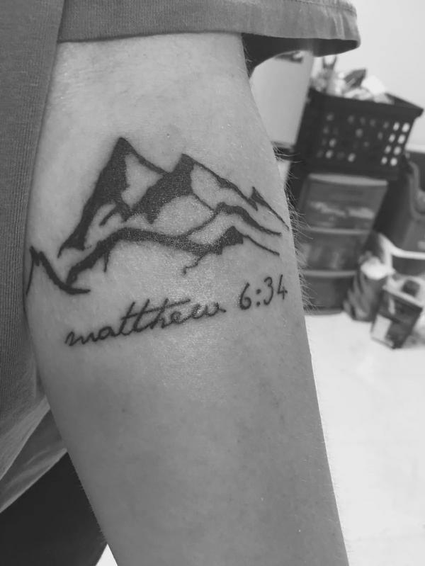 Matthew 6 34 with mountain tattoo