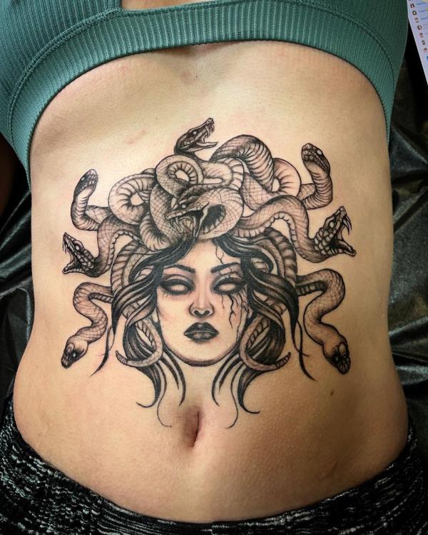 Medusa stomach tattoo black and grey