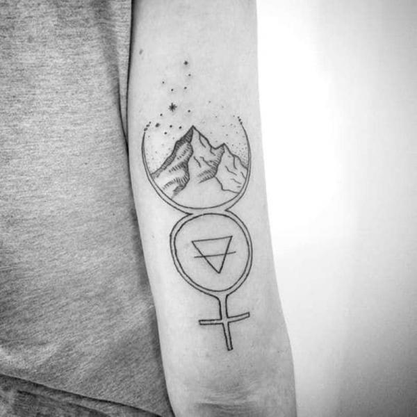 Mercury glyph with mountain and Virgo constellation tattoo