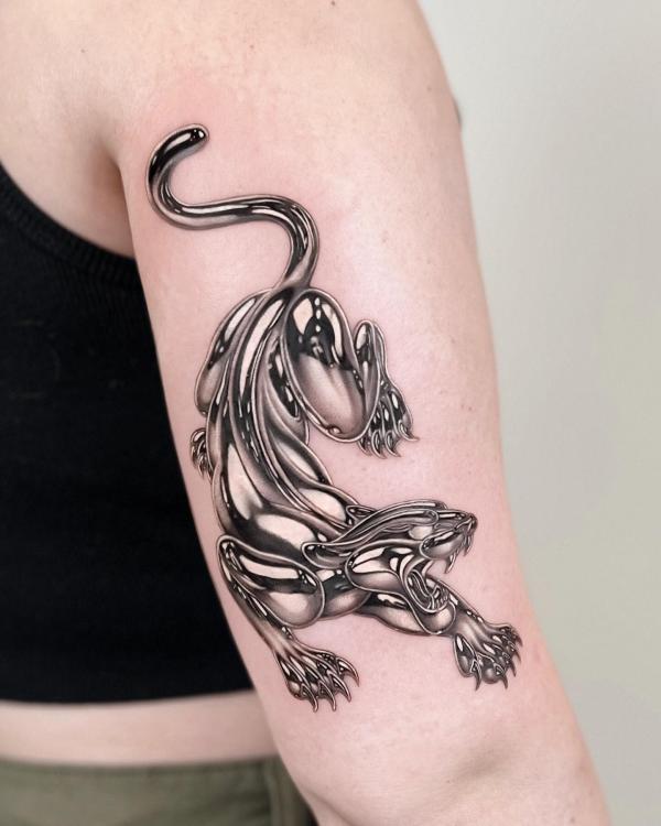 Metallic silver panther tattoo