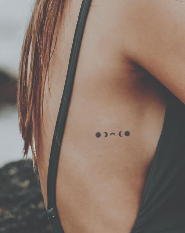 Minimalist moon phases silhouette tattoo