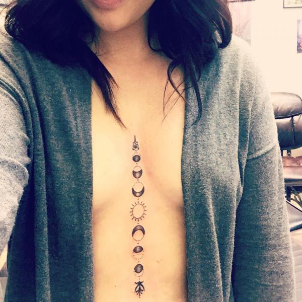 Moon phase and sun sternum tattoo