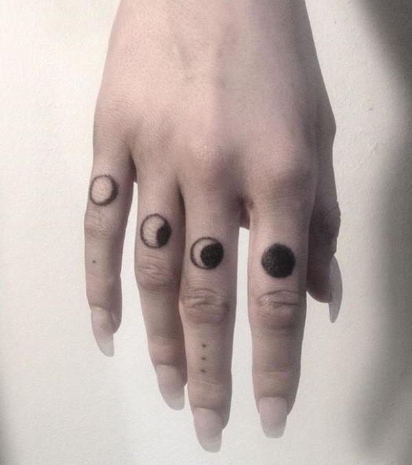 Moon phase finger tattoo