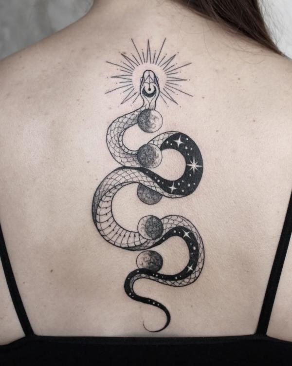 Moon phases and snake back tattoo