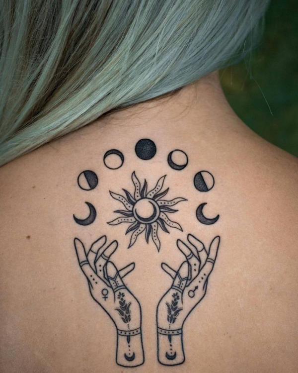 Moon phases and sun tattoo on back