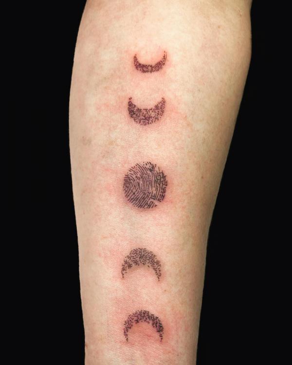 Moon phases fingerprint tattoo