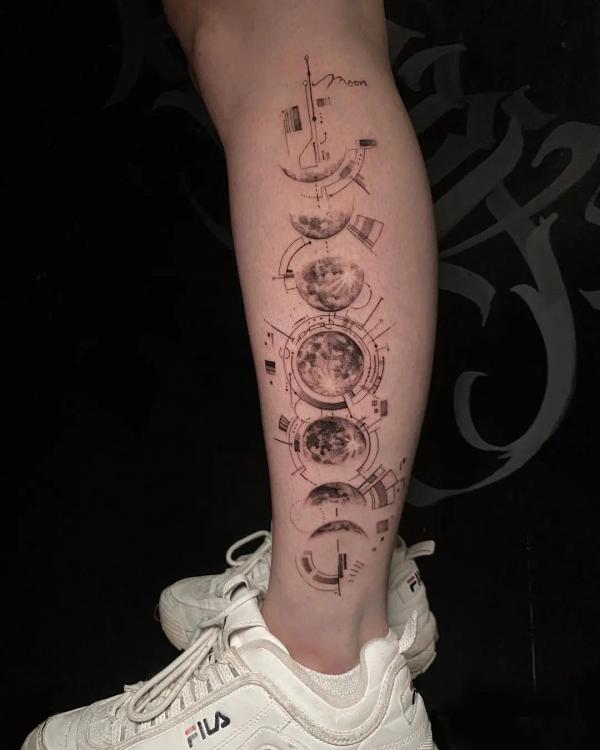 Moon phases lower leg tattoo