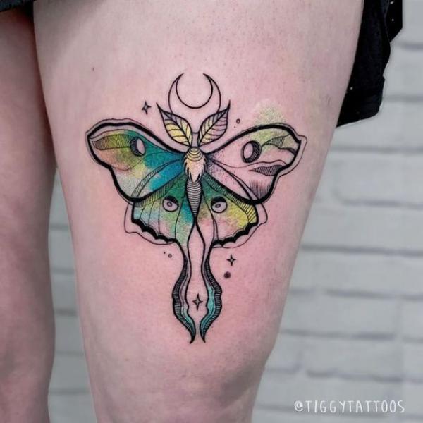 Moon phases luna moth thigh tattoo