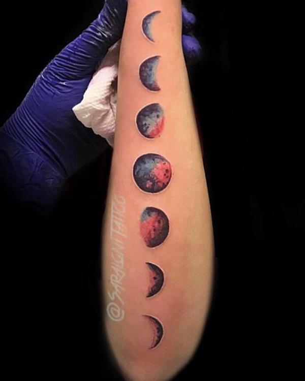 Moon phases outer forearm tattoo
