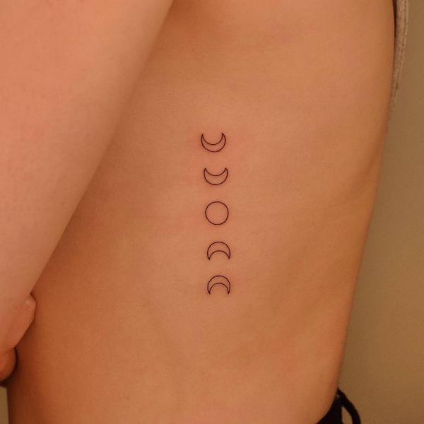 Moon phases outline tattoo on side