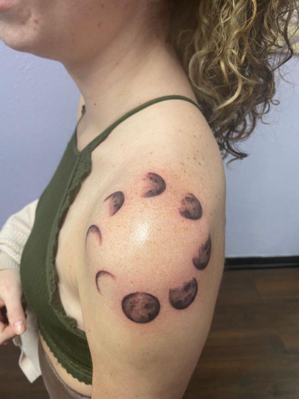 Moon phases shoulder cap tattoo