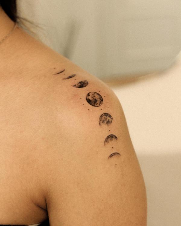Moon phases shoulder tattoo