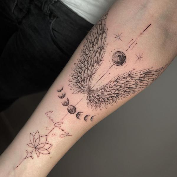 Moon phases with wings tattoo