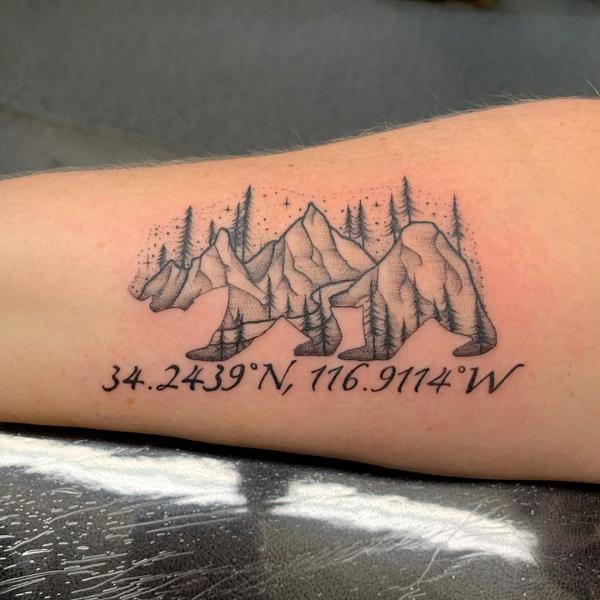 Mountain and trees with coordinates tattoo
