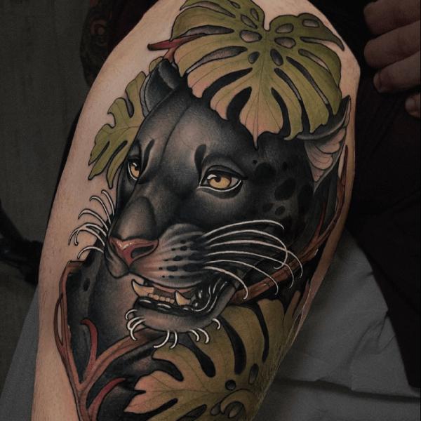 Neo traditional black panther with oak leaf tattoo on thigh