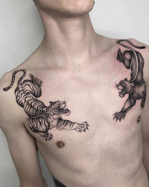 Panther and tiger chest tattoo
