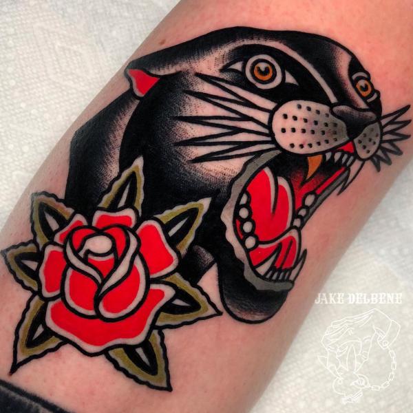 Panther head and rose tattoo traditional