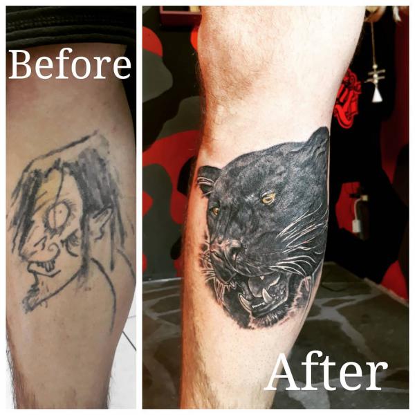 Panther head cover up tattoo on calf