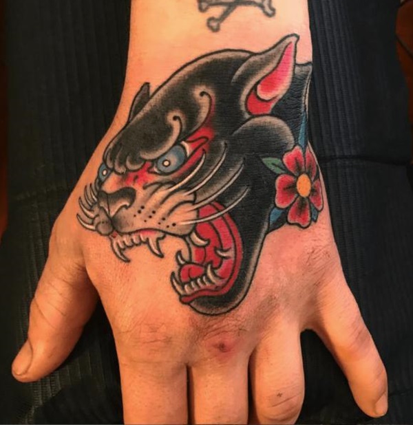 Panther head hand tattoo traditional