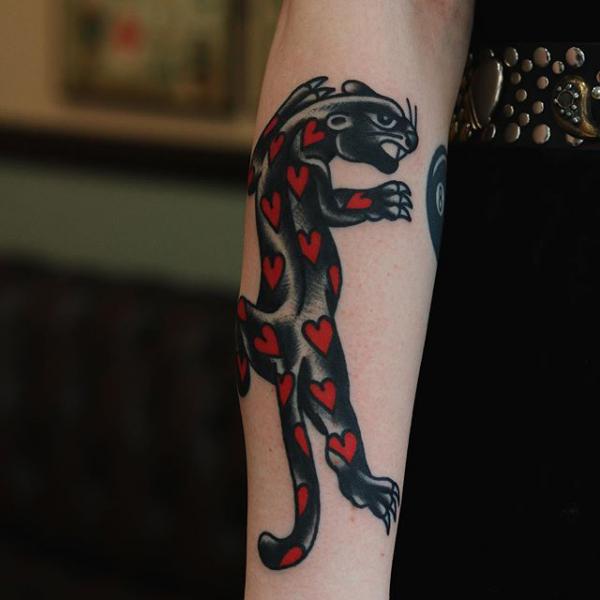 Panther tattoo with love hearts