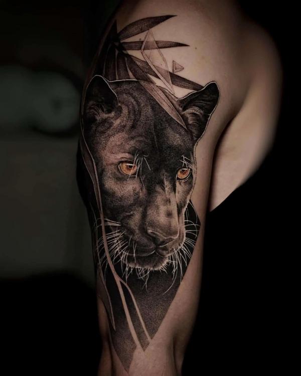 Panther upper arm tattoo