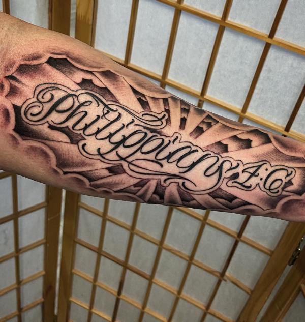 Philippians 4 6 with halo forearm tattoo