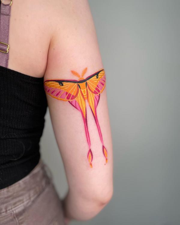 Pink and yellow luna moth tattoo