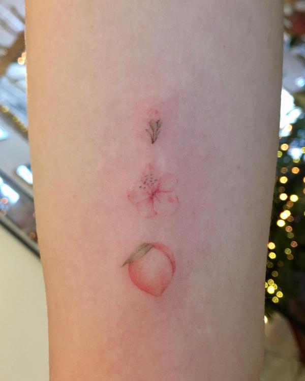 Pink peach and flower tattoo