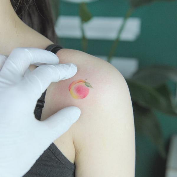 Pink peach shoulder tattoo