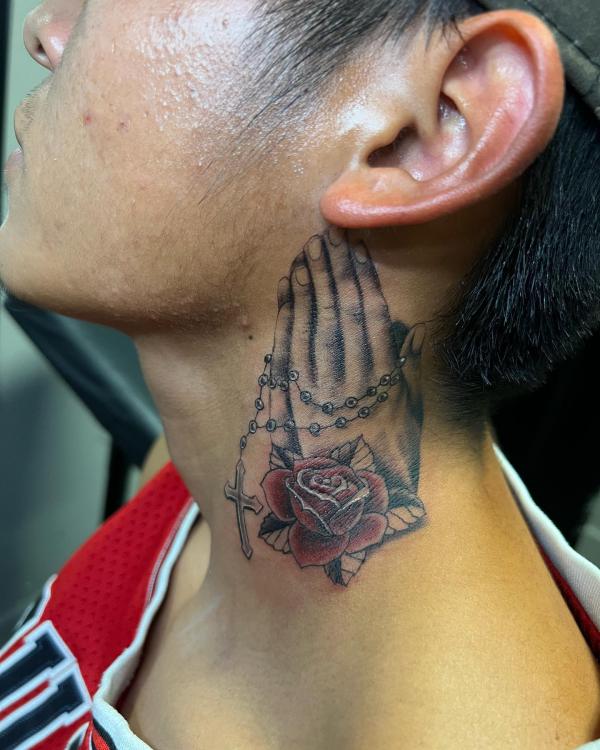Praying hands with rose neck tattoo