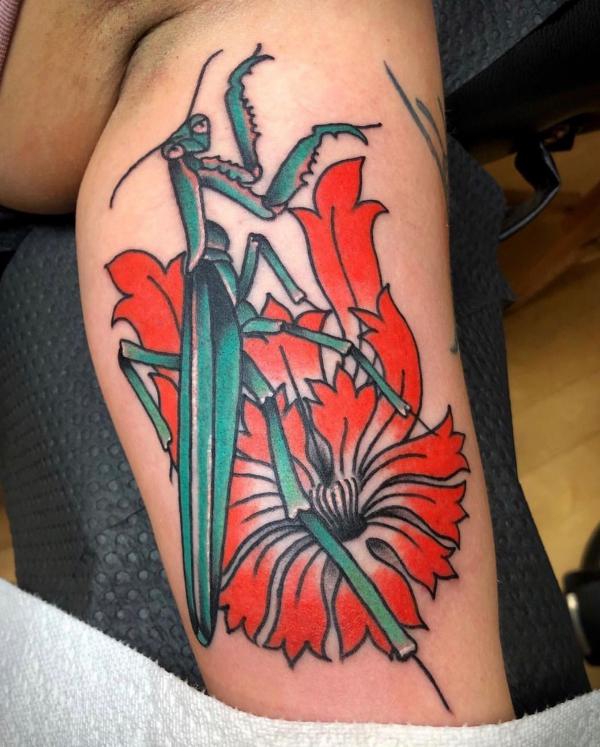 Praying mantis and flower calf tattoo