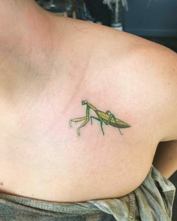 Praying mantis clavicle tattoo