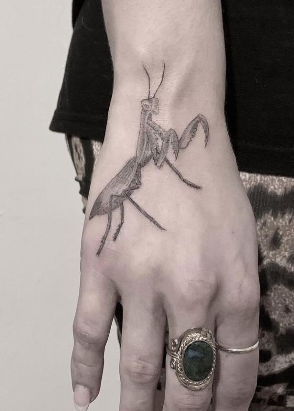 Praying mantis hand tattoo