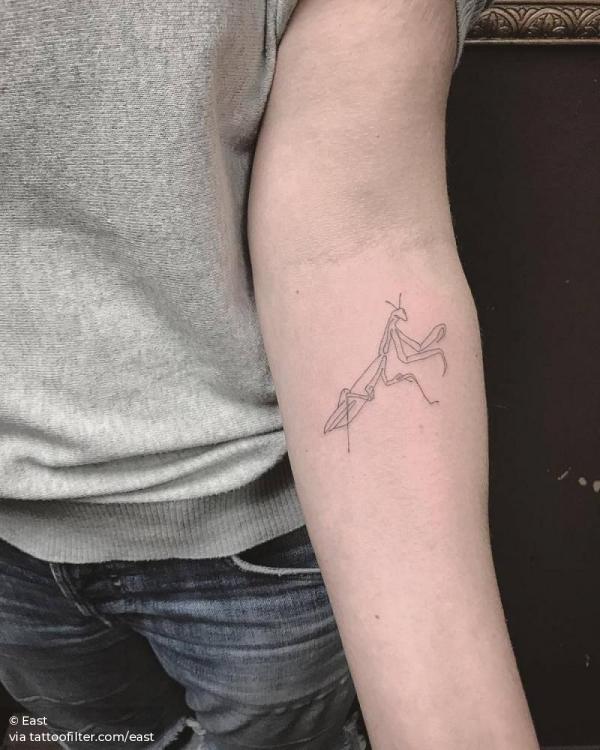 Praying mantis outline tattoo on forearm