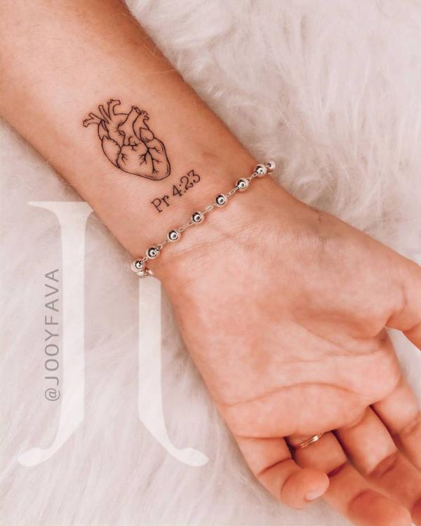 Proverbs 4 23 with heart wrist tattoo