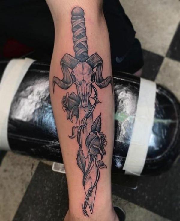 Ram dagger with rose tattoo