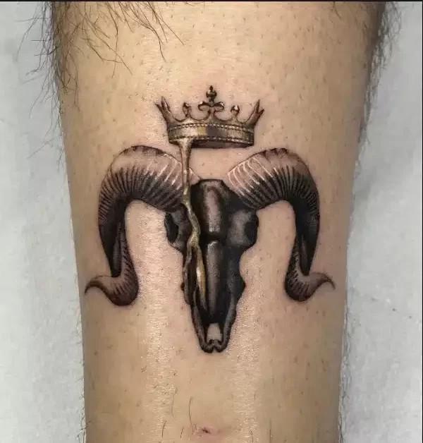 Realistic Aries Ram with crown tattoo