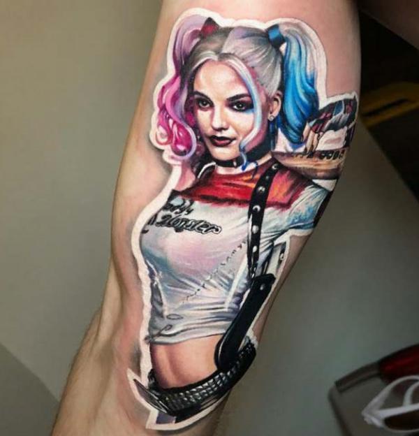 Realistic Harley Quinn bicep tattoo
